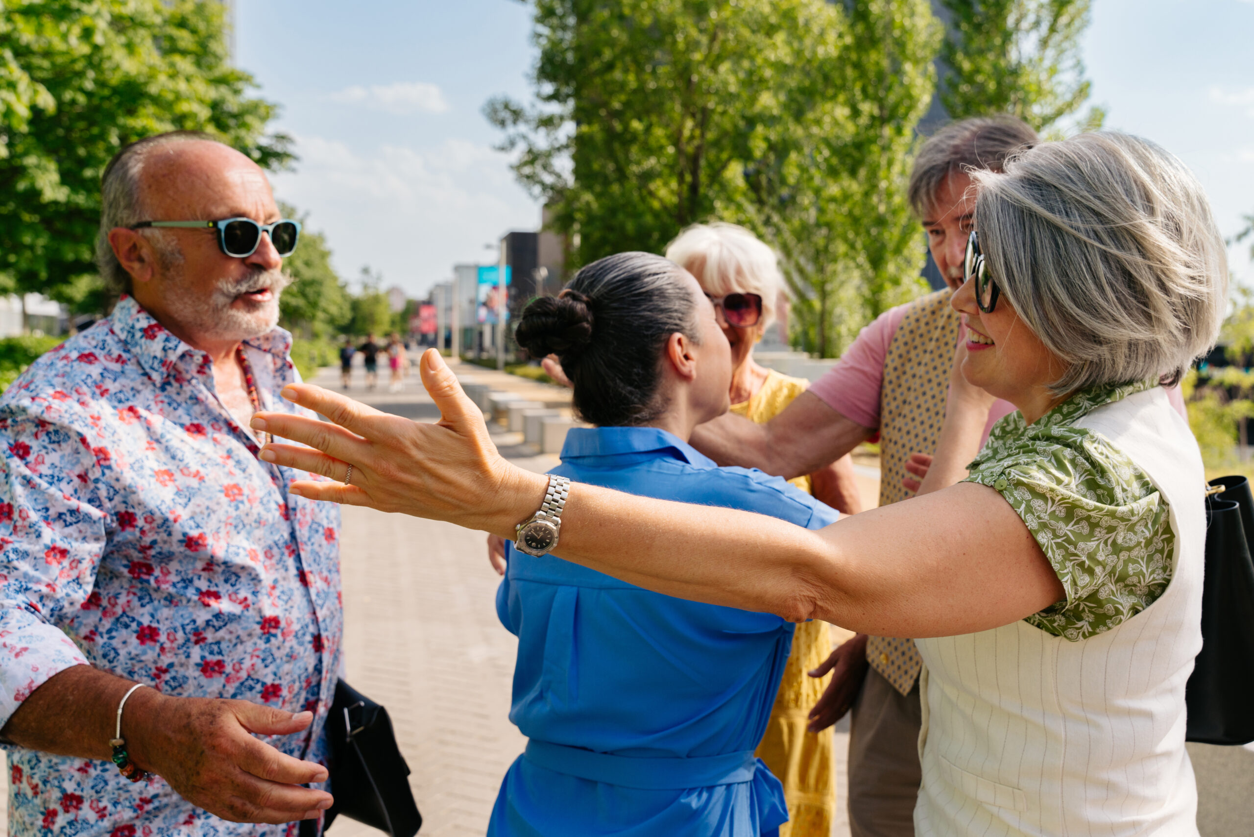 Group of senior friends meeting outdoors in the city and having fun - Cheerful old people bonding together, concepts about elderly, quality of life and aging lifestyle